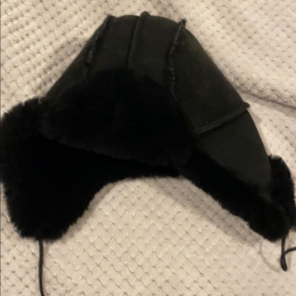 Very warm black shearling hat with ear mufflers